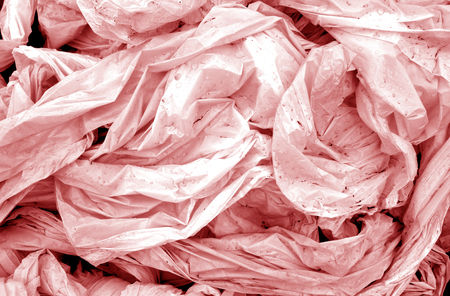 Dirty crumpled pvc in red tone. Abstract background and texture for design.の写真素材