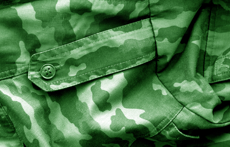 Military uniform pattern with blur effect in green tone. Abstract background and texture.の写真素材