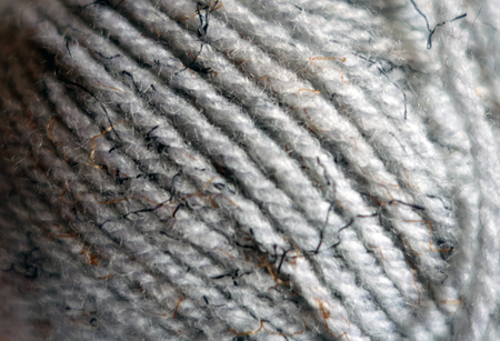 Yarn ball close-up with blur effect. Abstract background and texture for design.