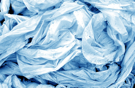Dirty crumpled pvc in navy blue tone. Abstract background and texture for design.