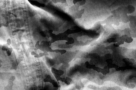 Dirty camouflage cloth in black and white. Abstract background and texture for design abd ideas.の写真素材