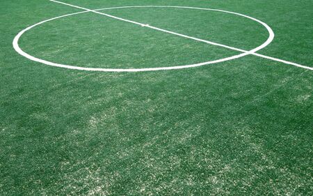 Fragment of footbal field with artificial grass. Sports background.の写真素材