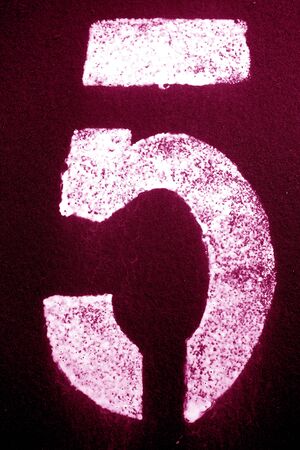 Number 5 in stencil on metal wall in pink tone. Abstract background and texture for design.の写真素材