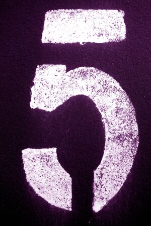 Number 5 in stencil on metal wall in purple tone. Abstract background and texture for design.の写真素材