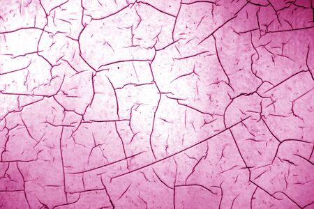 Cracked paint texture in pink color. Abstract architectural background and texture for design.の写真素材