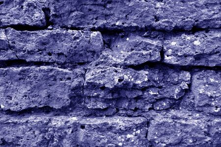 Old grungy brick wall texture in blue tone. Abstract architectural background and texture for design.の写真素材
