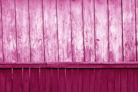 Old grunge wooden fence and wooden wall pattern in pink tone. Abstract background and texture for design.の写真素材