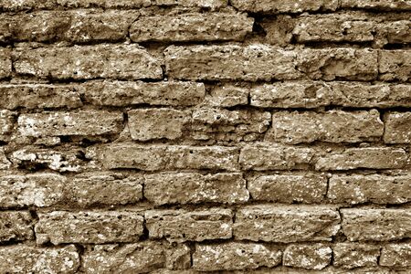Old grungy brick wall texture in brown tone. Abstract architectural background and texture for design.の写真素材