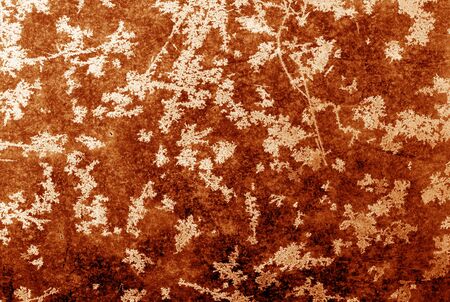 Abstract frost pattern on glass in orange tone. Abstract background and texture for design.