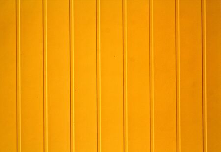 Yellow color plastic siding surface. Abstract background and texture.の写真素材