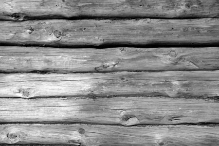 Weathered wooden fence in black and white. Abstract background and texture for design.