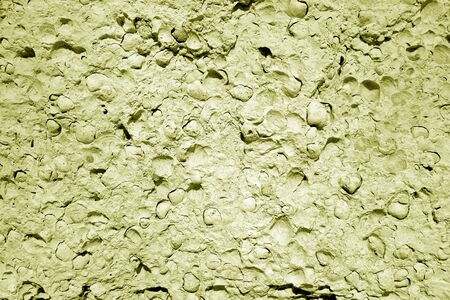 Shell rock stone close-up in yellow tone. Abstract background and texture for design.の写真素材