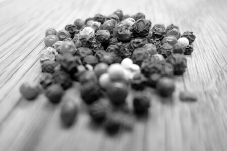 Mix of pappers on wooden board with blur effect in black and white. Food and ingredients background with blur effect.の写真素材