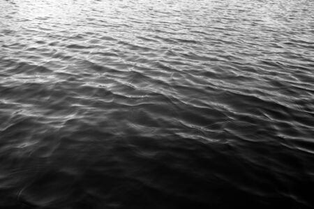 Waves on lake water surface. Abstract natural background.               