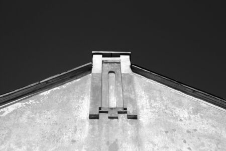 Wall and roof of old house in black and white. Urban backgroundの写真素材