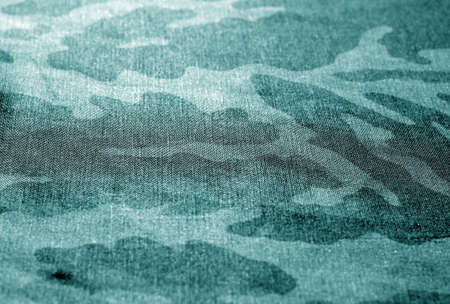 camouflage uniform background with blur effect. Texture and pattern for designの写真素材