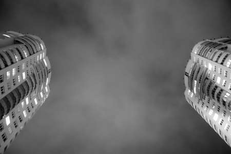 Modern high residential building at night. Architectural and urban backgroundの写真素材