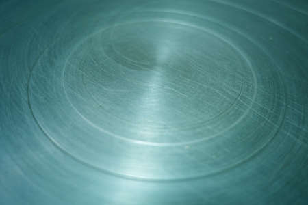 Scratched round metal surface. Background and texture for design. Blur effectの写真素材