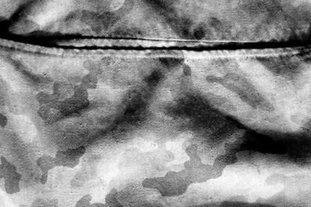 Old camouflage cloth with blur effect in black and white. Abstract background and texture for design abd ideas.の写真素材
