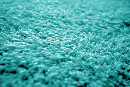 Bath towel texture with blur effect in cyan color. Abstract background and texture for design.