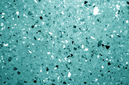 Cement plate with small gravel stones in cyan tone. Abstract background and texture for design.の写真素材