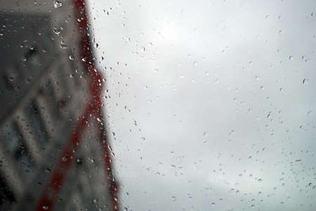Snow and rain drops on car window. Background and view for ideas