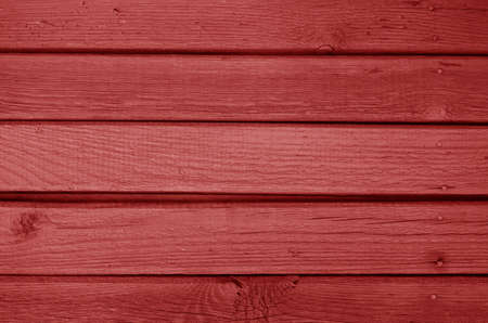 Old grungy wooden planks background in red color. Abstract background and texture for design.の写真素材