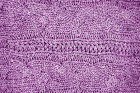 Warm knitting texture in purple tone. background and texture for design.の写真素材
