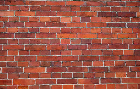 Red color brick wall surface. Abstract architectural background and texture for design.