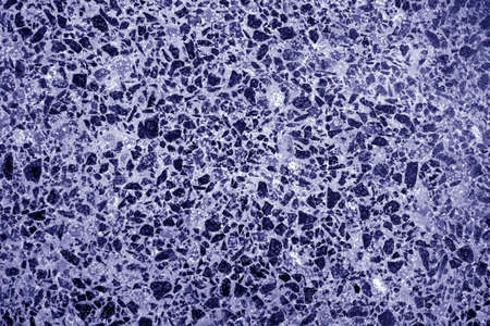 Cement with gravel stones surface in blue tone. Abstract architectural background and texture for design.の写真素材
