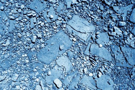 Gravel stones road in navy blue tone. Seasonal background and natural pattern.の写真素材