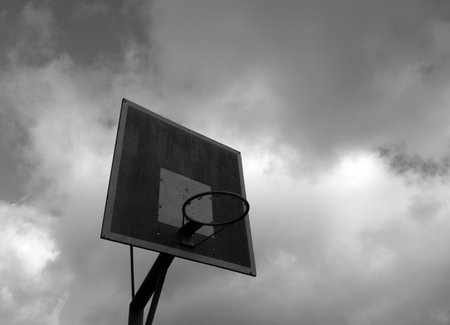 Old basketball ring against sky. Sport and leisure.の写真素材