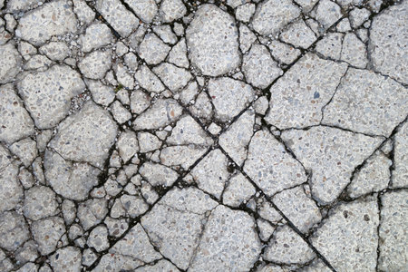 Cracked asphalt road texture. Background and pattern for design.の写真素材