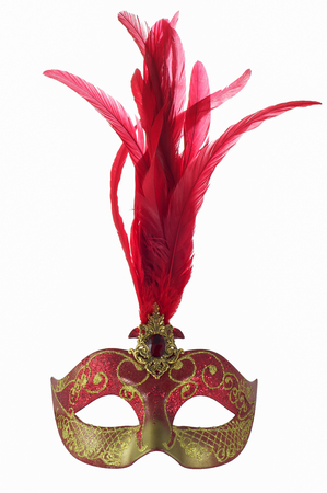 Venice carnival masquerade mask with red feathers and ruby isolated on white backgroundの写真素材