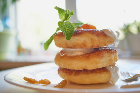perfect morning. breakfast of the chosen ones. stack of delicious pancakes. side view against bright light from the windowの写真素材