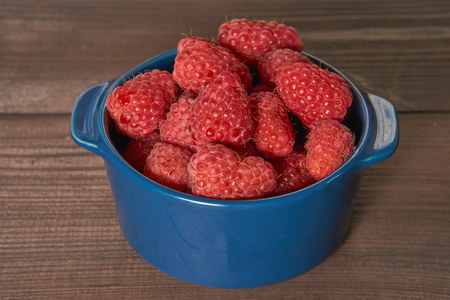 ceramic bowl with raspberries. low angle shot