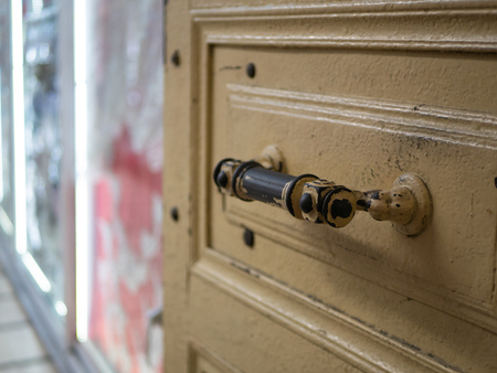 opened door with door handle knob to the shop with showcase and led backlightの写真素材