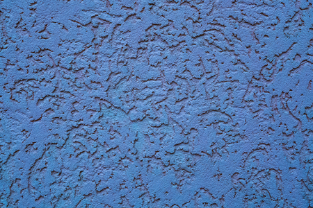 concrete blue wall texture abstract background with grooves, notches, tracks like made by ants. asymmetrical design. close up detailed shotの写真素材