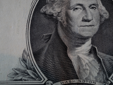 macro portrait of first president of United States George Washington on one dollar bill bank noteの写真素材