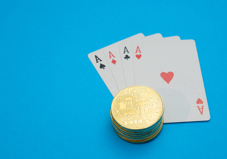 stack pile of cryptocurrency on playing cards. internet online casino gambling concept. close-up...