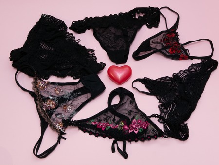 set of womans girls black sexy panties around red heartの写真素材