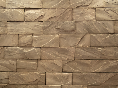 brown rough stone block wall pattern for backgroundの写真素材