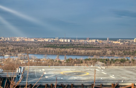 beautiful cityscape landscape with building in foreground with helicopter helipad on roofの写真素材