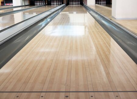 close-up of one empty bowling track lane at entertainment centerの写真素材