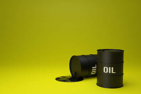 two black barrels of petroleum on yellow background. small puddle of crude oil spilled on a ground....