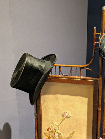 magicians black hat hanging on a dressing board screen shieldの写真素材