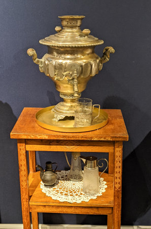 vintage samovar old tea kettle on wooden stoolの写真素材
