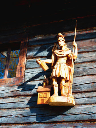Wooden statue of St. Florian in the Wallachian Museum in nature. Roznov under Radhost. Czech Republic.の写真素材