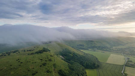 Panoramic nature mountains landscape. Dramatic sky at sunset. Aerial drone view from above