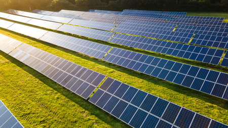 Solar power farm in the evening, fields of West Sussex, UK.の写真素材